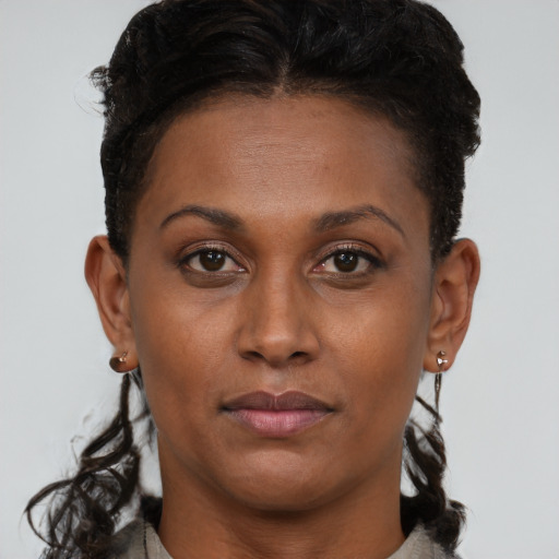 Neutral black young-adult female with short  brown hair and brown eyes