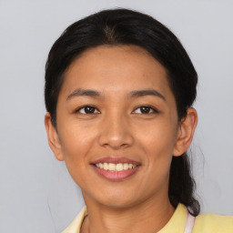 Joyful asian young-adult female with short  black hair and brown eyes