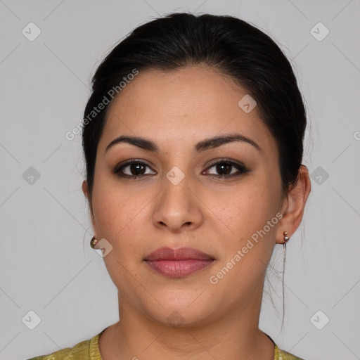 Joyful latino young-adult female with medium  brown hair and brown eyes