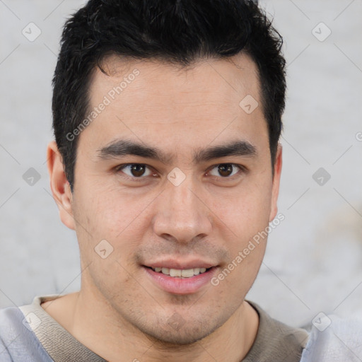 Joyful latino young-adult male with short  brown hair and brown eyes