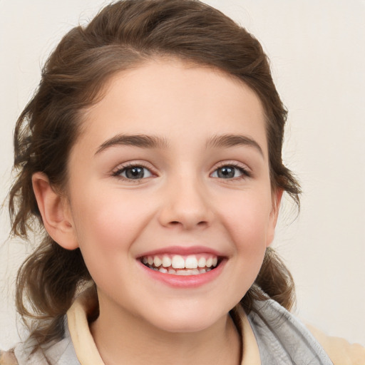 Joyful white child female with medium  brown hair and brown eyes