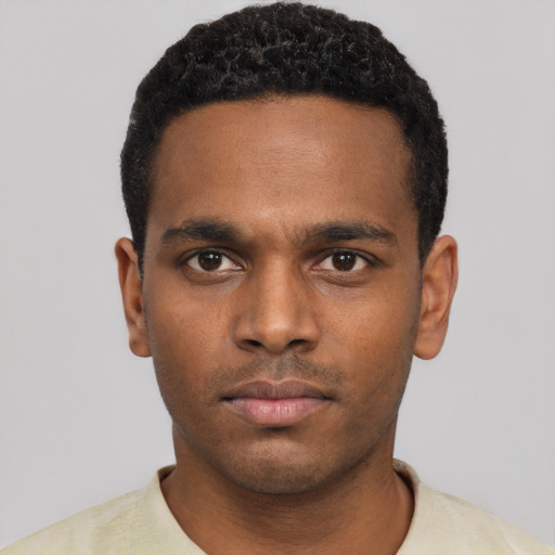 Neutral black young-adult male with short  black hair and brown eyes