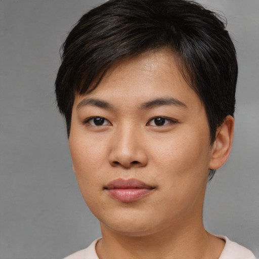 Joyful asian young-adult female with short  black hair and brown eyes