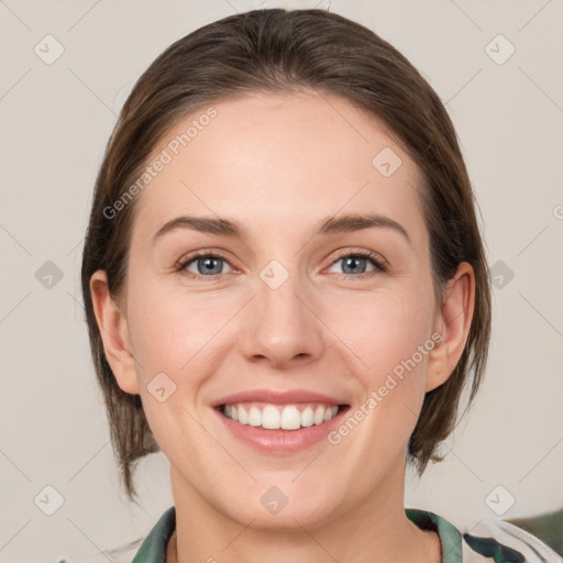 Joyful white young-adult female with medium  brown hair and grey eyes