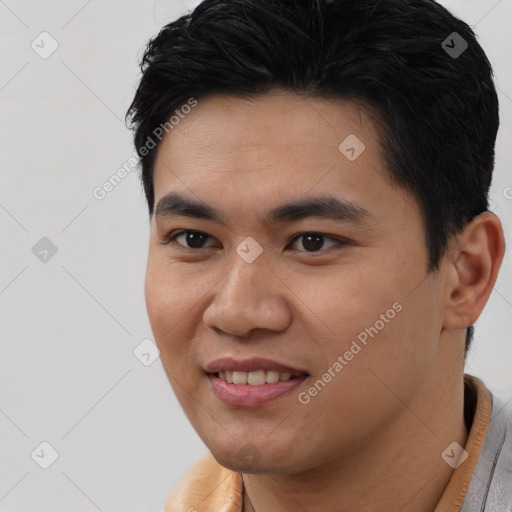 Joyful latino young-adult male with short  black hair and brown eyes