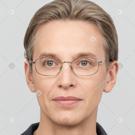 Joyful white adult male with short  brown hair and grey eyes