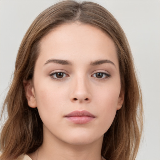 Neutral white young-adult female with long  brown hair and brown eyes