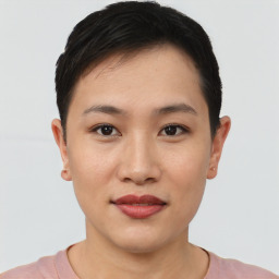 Joyful asian young-adult female with short  black hair and brown eyes