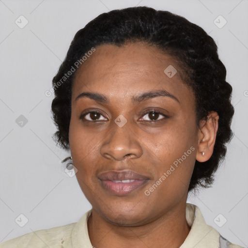 Joyful black adult female with short  black hair and brown eyes