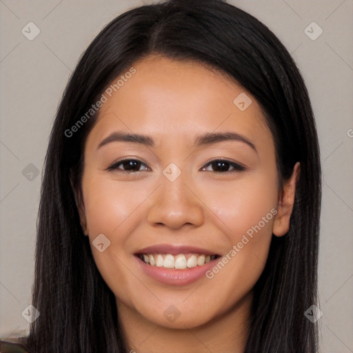 Joyful latino young-adult female with long  brown hair and brown eyes