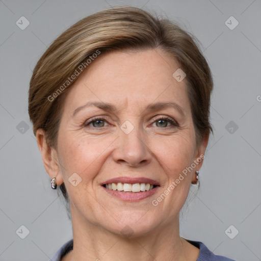 Joyful white adult female with medium  brown hair and grey eyes