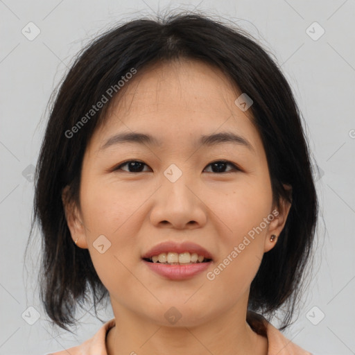 Joyful asian young-adult female with medium  brown hair and brown eyes