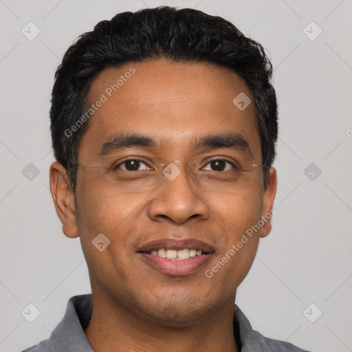 Joyful latino young-adult male with short  black hair and brown eyes
