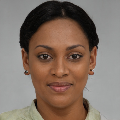 Joyful latino young-adult female with short  brown hair and brown eyes