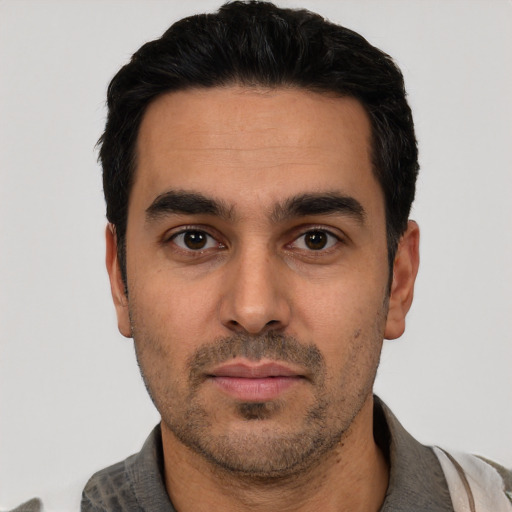 Neutral white young-adult male with short  black hair and brown eyes