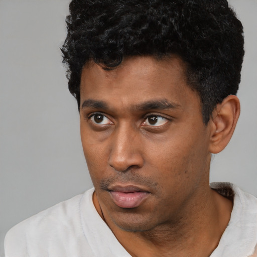 Neutral black young-adult male with short  black hair and brown eyes