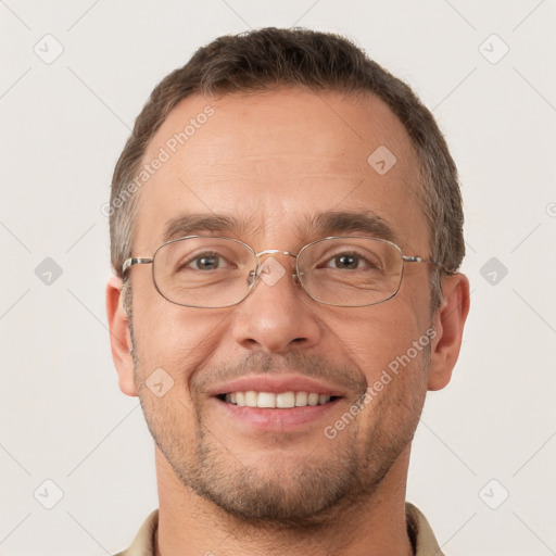 Joyful white adult male with short  brown hair and brown eyes