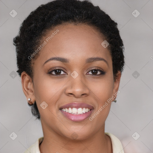 Joyful black young-adult female with short  brown hair and brown eyes