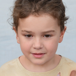 Joyful white child male with short  brown hair and brown eyes