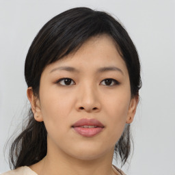 Joyful asian young-adult female with medium  black hair and brown eyes