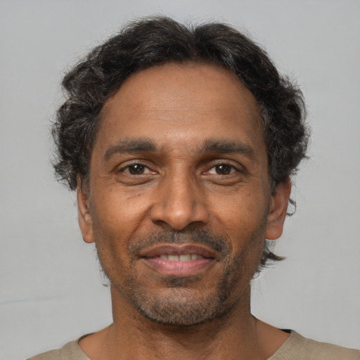 Neutral latino adult male with short  brown hair and brown eyes
