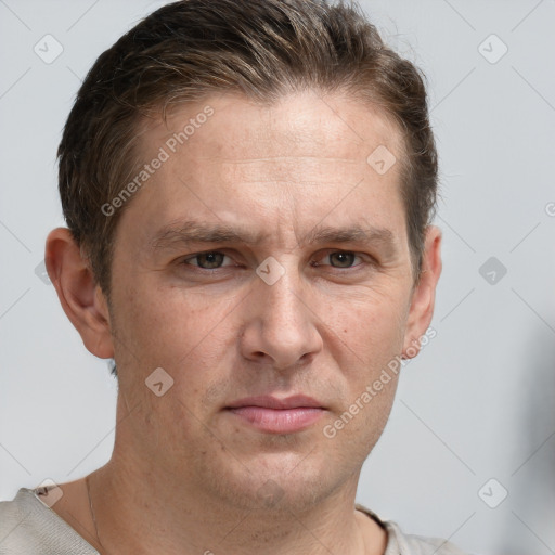 Joyful white adult male with short  brown hair and grey eyes