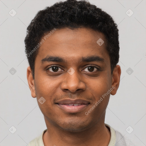 Joyful black young-adult male with short  brown hair and brown eyes