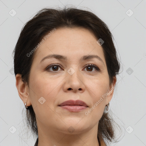 Joyful white adult female with medium  brown hair and brown eyes