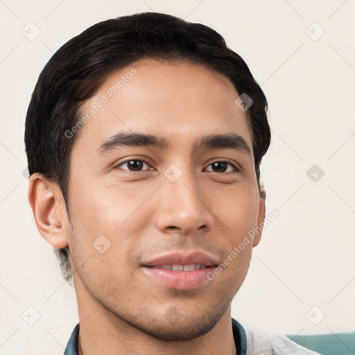 Joyful white young-adult male with short  black hair and brown eyes