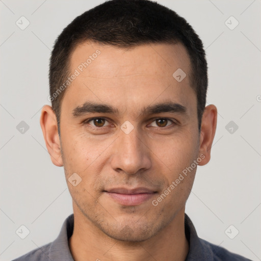 Joyful white young-adult male with short  brown hair and brown eyes