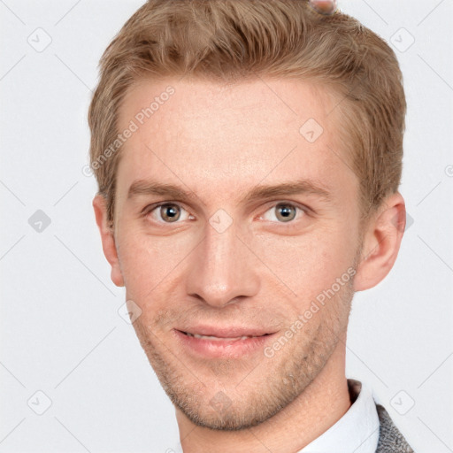 Joyful white adult male with short  brown hair and grey eyes