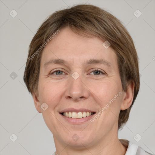 Joyful white adult female with medium  brown hair and grey eyes