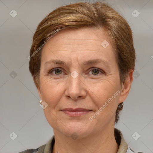 Joyful white middle-aged female with medium  brown hair and grey eyes