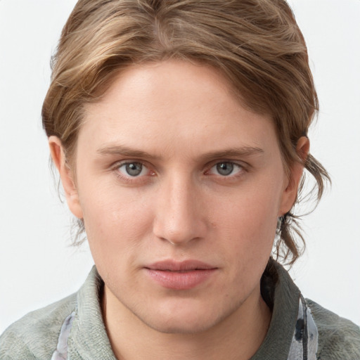 Joyful white young-adult female with medium  brown hair and grey eyes