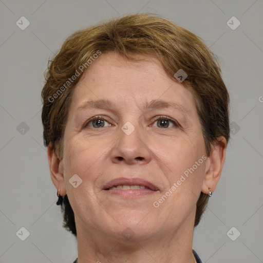 Joyful white adult female with short  brown hair and grey eyes