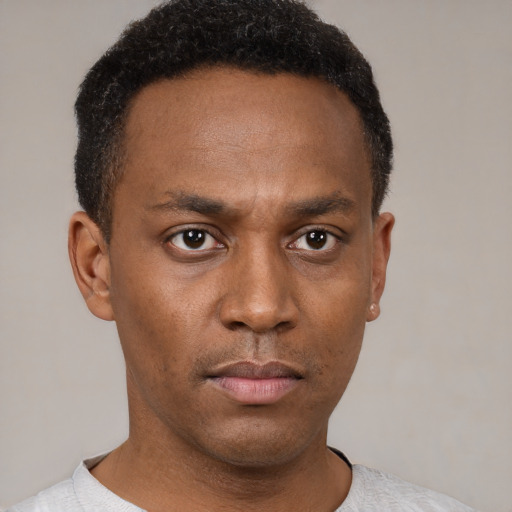Neutral latino young-adult male with short  brown hair and brown eyes