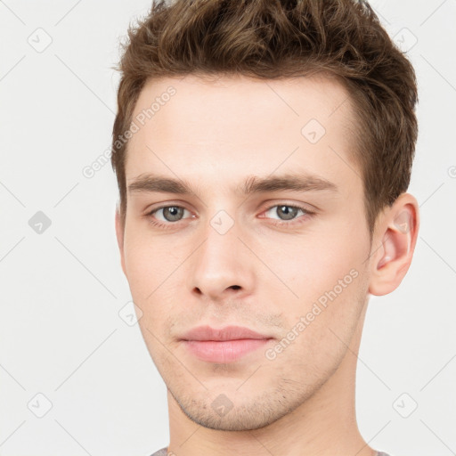 Neutral white young-adult male with short  brown hair and brown eyes