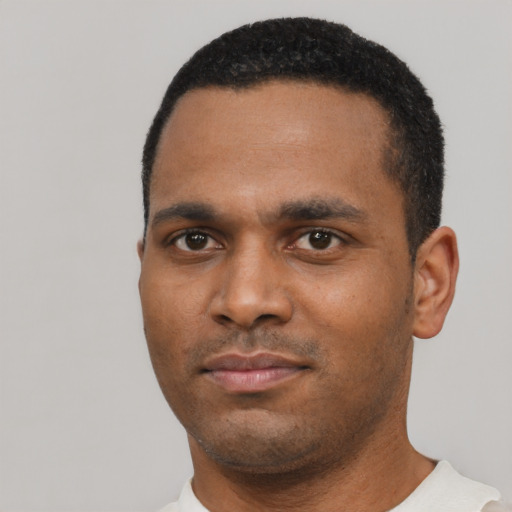 Neutral black young-adult male with short  black hair and brown eyes