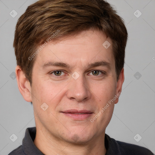 Joyful white adult male with short  brown hair and grey eyes