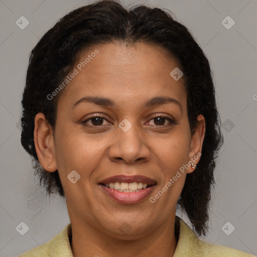 Joyful latino adult female with short  brown hair and brown eyes