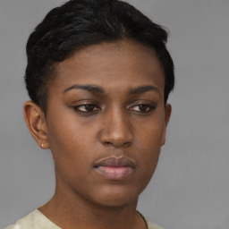 Neutral black young-adult female with short  brown hair and brown eyes