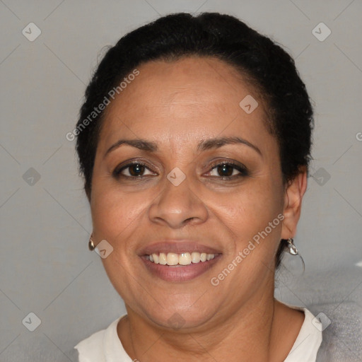 Joyful latino adult female with short  brown hair and brown eyes