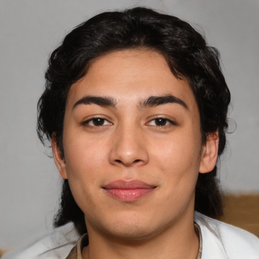 Joyful white young-adult female with medium  black hair and brown eyes