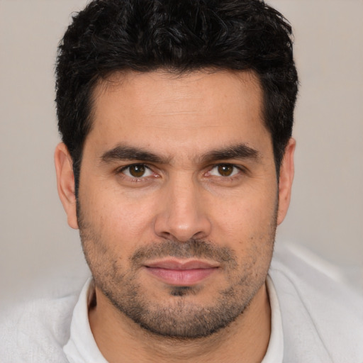 Neutral white young-adult male with short  black hair and brown eyes