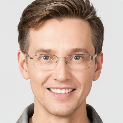 Joyful white adult male with short  brown hair and grey eyes