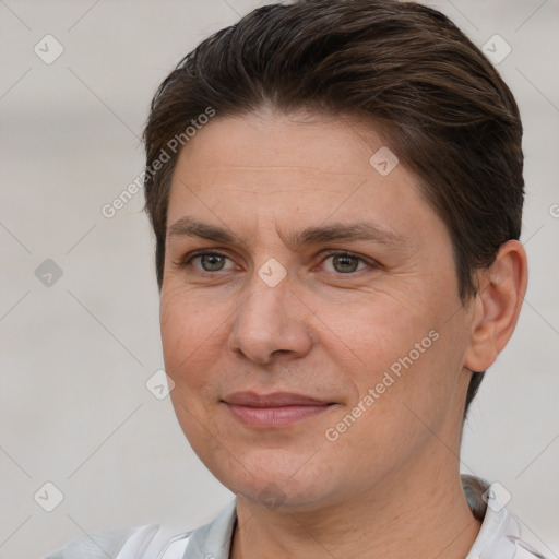 Joyful white adult female with short  brown hair and brown eyes