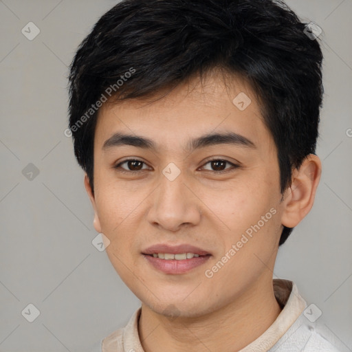 Joyful asian young-adult male with short  brown hair and brown eyes