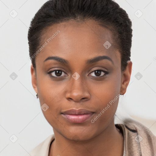 Joyful black young-adult female with short  brown hair and brown eyes