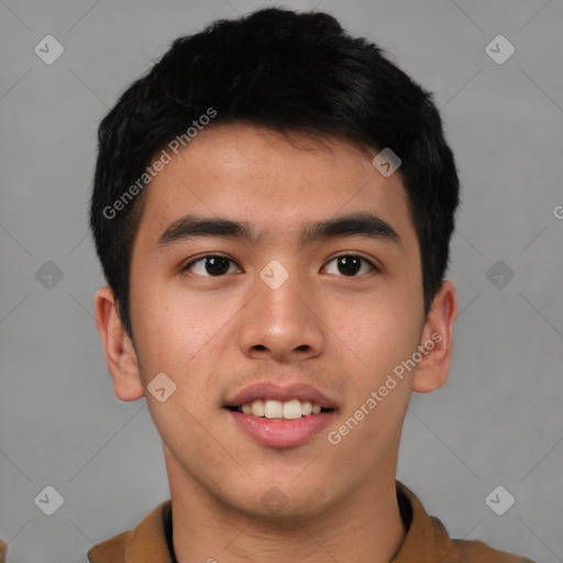 Joyful asian young-adult male with short  brown hair and brown eyes