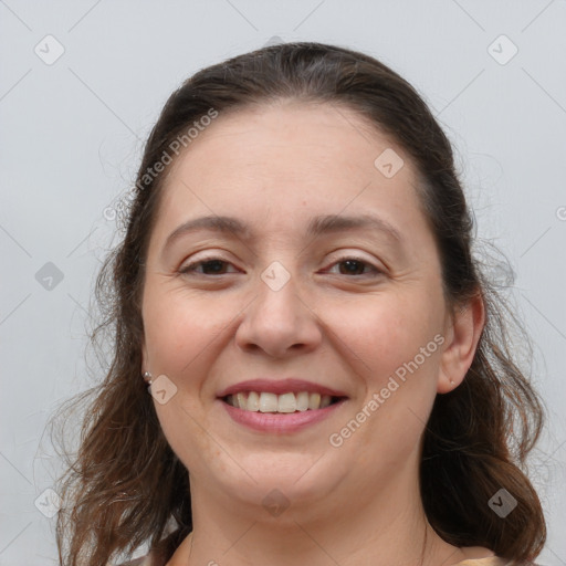 Joyful white adult female with medium  brown hair and brown eyes